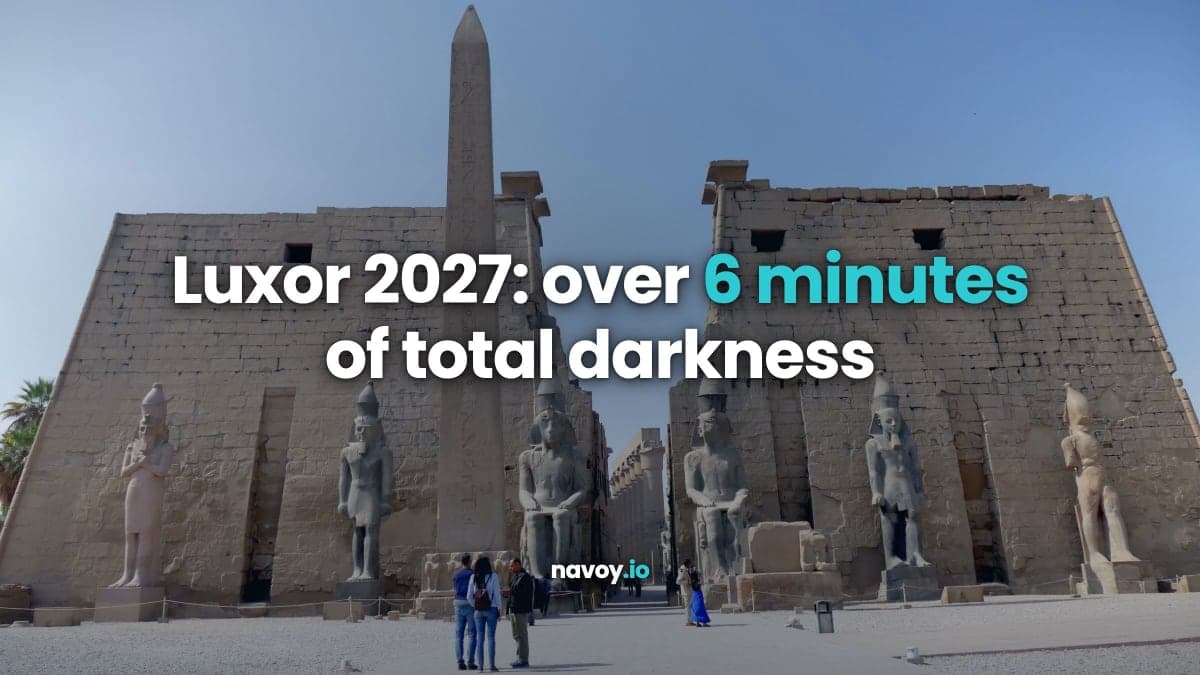 Luxor Temple entrance with its obelisk and statues of Ramses II under a clear sky in Luxor, Egypt