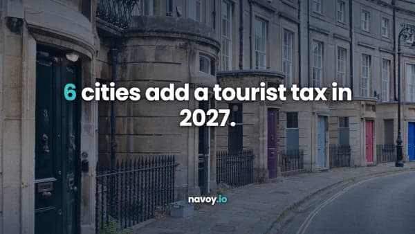A row of Georgian townhouses on a UK city street in daylight, headlined 6 cities add a tourist tax in 2027